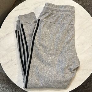 Light gray Adidas joggers with black stripes down sides; Size Small